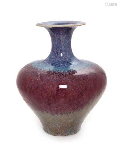 * A Flambe Glazed Stoneware Vase Height 10 1/2 inches.