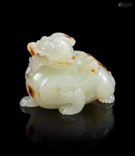 A Celadon and Russet Jade Carving of a Mythical Beast,