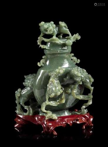 * A Spinach Jade 'Fu Lion' Vase and Cover Height 8