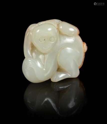 A Celadon and Russet Jade Figure of a Monkey Height 1