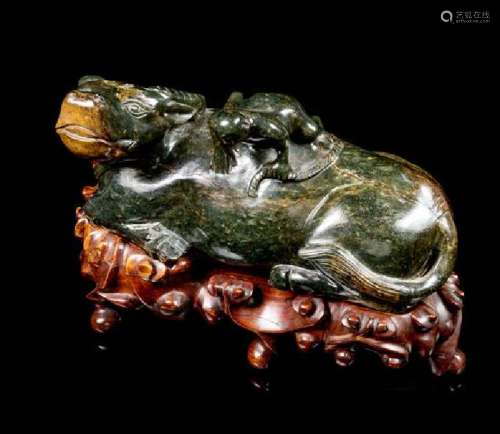 * A Spinach Jade Figural Group of a Ox and a Frog