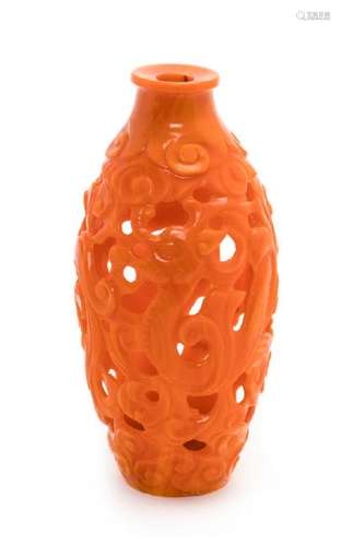 * A Small Realgar Glass Openwork Chilong Bottle Height