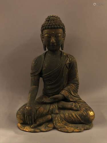 A GILT BRONZE FIGURE OF A SEATED SAKYAMUNI BUDDHA