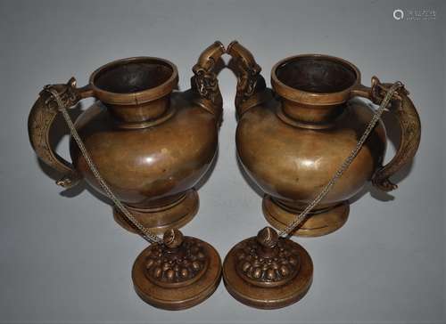 A PAIR OF TIBETAN BRONZE TEA POTS