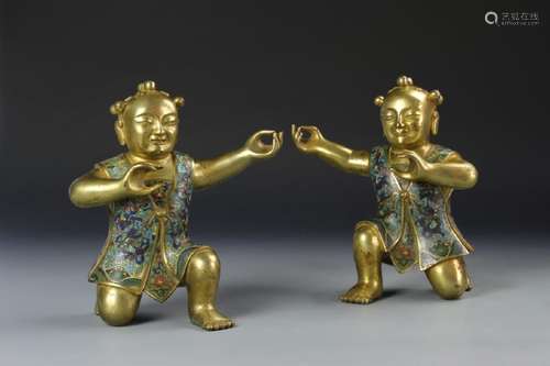 A PAIR OF ENAMELED BOYS