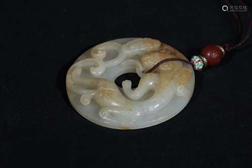 A HETIAN JADE CARVED CIRCLE PLAQUE