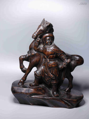 A CHENXIANG WOOD CARVING OF HORSE AND MAN