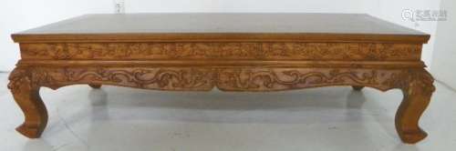 A HARDWOOD CARVED TABLE