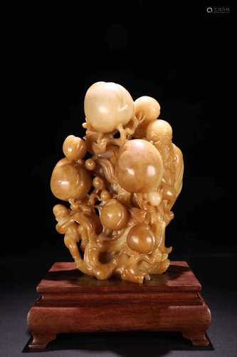 A TIANHUANG JADE FIGURE OF PEACH AND LIFE GOD