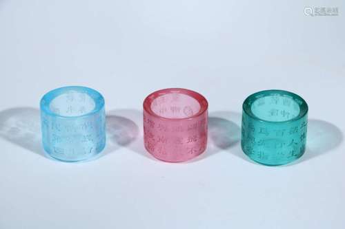 THREE PEKING GLASS INSCRIBED RINGS