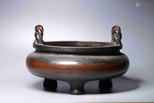 A BRONZE TRIPOD CENSER