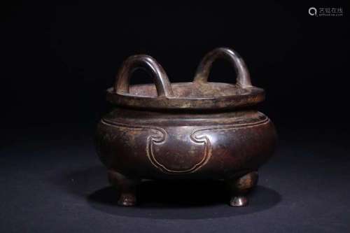 A BRONZE TRIPOD CENSER