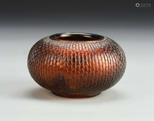 A BROWN PEKING GLASS JAR