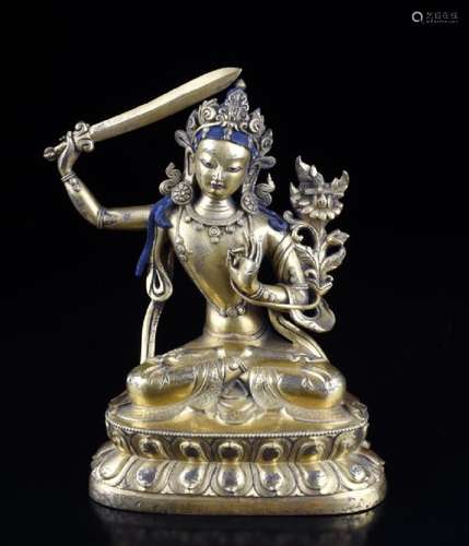 A GILT BRONZE GREEN TARA FIGURE