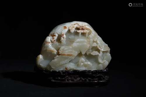 A HETIAN CARVED 'MOUNTAIN' ORNAMENT