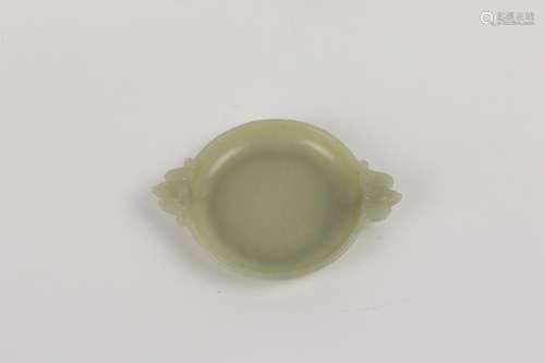 A GREEN JADE PLATE