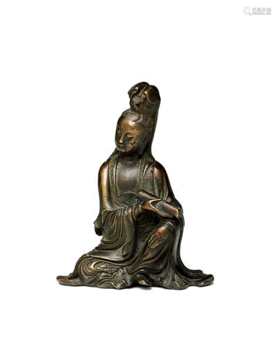 Qing dynasty A SMALL BRONZE FIGURE OF GUANYIN