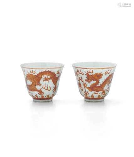 Tongzhi six-character marks and of the period A PAIR OF IRON-RED 'DRAGON' CUPS