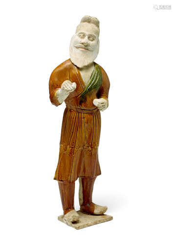 Tang dynasty A LARGE SANCAI-GLAZED POTTERY FIGURE OF A FOREIGN GROOM