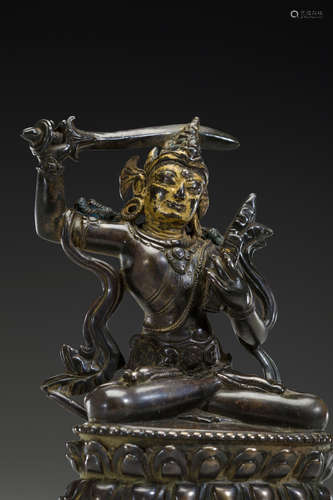 TIBET, CIRCA 12TH/13TH CENTURY A SILVER INLAID COPPER ALLOY FIGURE OF MANJUSHRI