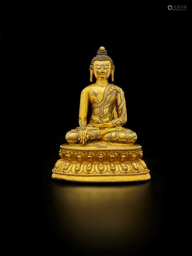 CENTRAL TIBET, 15TH CENTURY A SILVER INLAID GILT COPPER ALLOY FIGURE OF SHAKYAMUNI