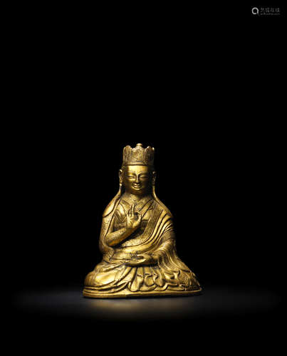 TIBET, 17TH CENTURY A GILT COPPER ALLOY FIGURE OF A BON TEACHER