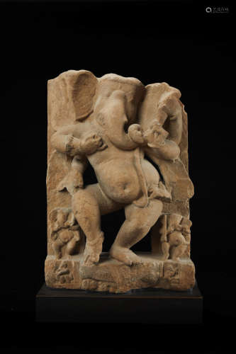 NORTH INDIA, 10TH/11TH CENTURY A BUFF SANDSTONE FIGURE OF DANCING GANESHA
