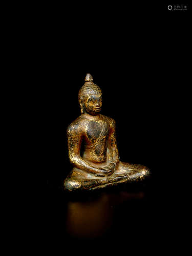 SRI LANKA, LATE ANURADHAPURA PERIOD, 10TH CENTURY  A GILT COPPER ALLOY FIGURE OF BUDDHA