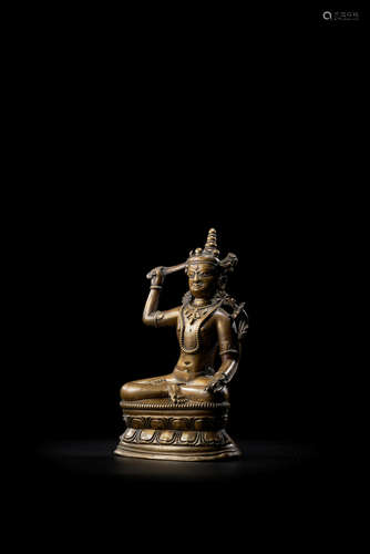 TIBET, CIRCA 13TH CENTURY A COPPER ALLOY FIGURE OF MANJUSHRI