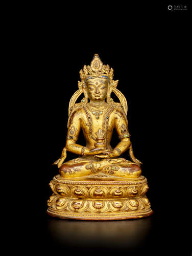 TIBET, CIRCA 14TH CENTURY A GILT COPPER ALLOY FIGURE OF AMITAYUS