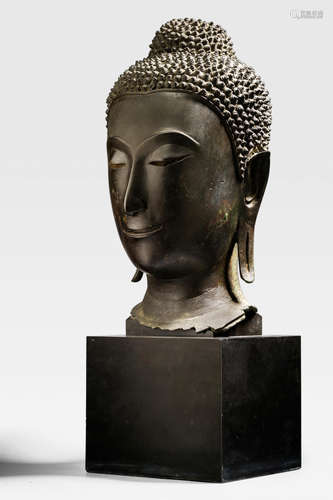 CENTRAL THAILAND, AYUTTHAYA PERIOD, CIRCA 1500 A LARGE COPPER ALLOY HEAD OF BUDDHA