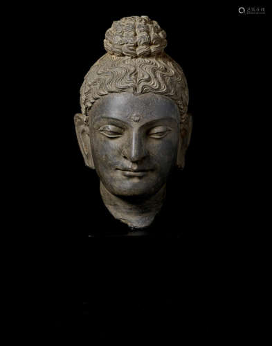 ANCIENT REGION OF GANDHARA, CIRCA 3RD CENTURY A SCHIST HEAD OF BUDDHA