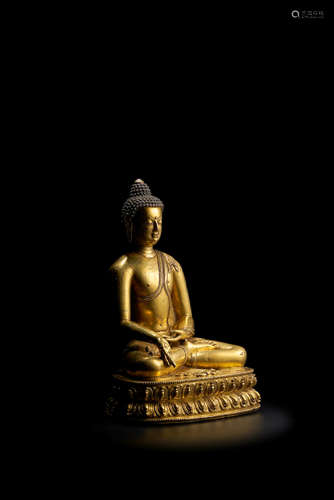 CENTRAL TIBET, 14TH/15TH CENTURY A GILT COPPER ALLOY FIGURE OF RATNASAMBHAVA