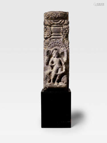 NORTH INDIA, CIRCA 9TH CENTURY A SANDSTONE GHATAPALLAVA PILLAR WITH A DVARAPALA