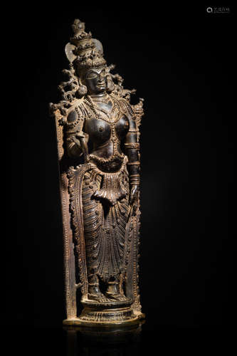SOUTH INDIA, KERALA, 16TH CENTURY A COPPER ALLOY FIGURE OF DEVI