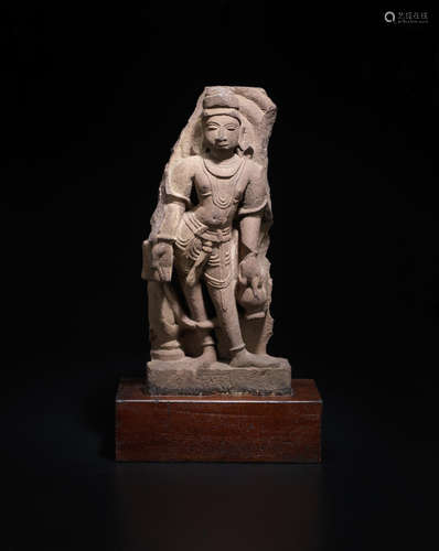 NORTH INDIA, CIRCA 12TH CENTURY  A SANDSTONE FIGURE OF A CELESTIAL ATTENDANT