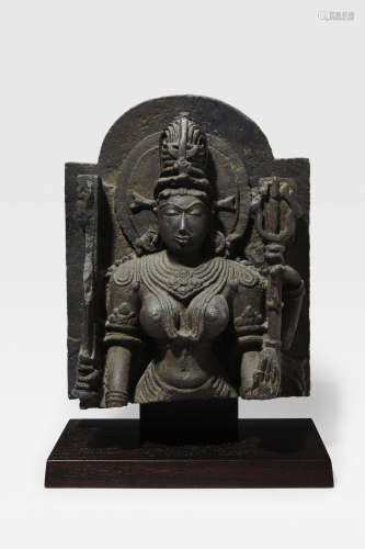 NORTH INDIA, CIRCA 12TH CENTURY  A BLACK STONE BUST OF DEVI