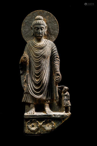 ANCIENT REGION OF GANDHARA, 3RD/4TH CENTURY A SCHIST FIGURE OF BUDDHA