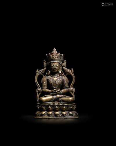 TIBET, CIRCA 13TH CENTURY A GOLD, COPPER, AND SILVER INLAID COPPER ALLOY FIGURE OF KUNZANG AKOR