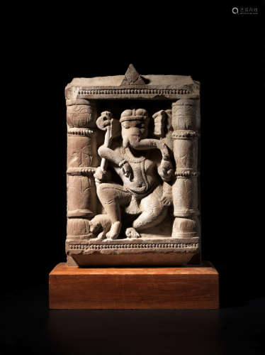 NORTH INDIA, CIRCA 10TH CENTURY A BUFF SANDSTONE PANEL OF DANCING GANESHA