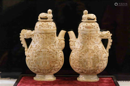 PAIR OF JADE CARVED 'MYTHICAL BEASTS' EWERS WITH LIDS