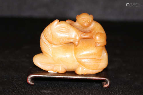 YELLOW JADE CARVED 'HORSE AND MONKEY' FIGURE WITH STAND