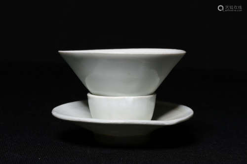 WHITE GLAZED TEA CUP AND SAUCER
