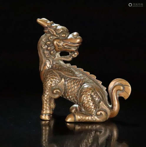 A BROZNE CASTED QILIN SHAPED PENDANT