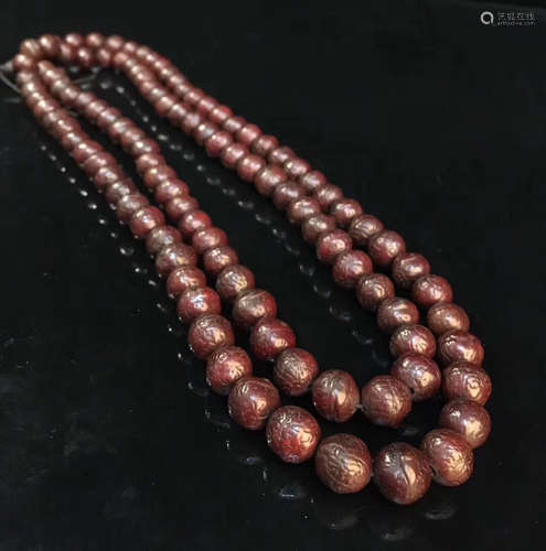 A PHOENIX EYE BODHI BEAD STRING NECKLACE