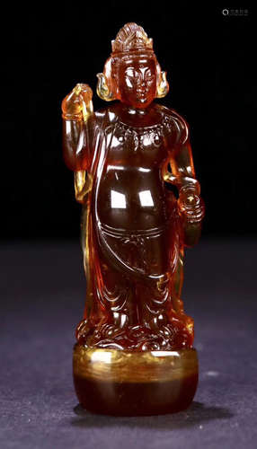 AN AMBER CARVED GUANYIN BUDDHA