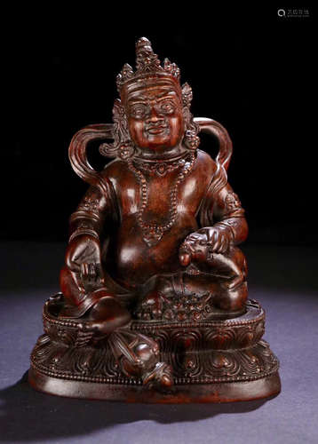 A CHENXIANG WOOD CARVED WEALTH BUDDHA