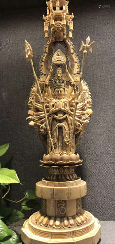 A GILT BRONZE MULTI ARMS BUDDHA