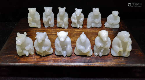 A HETIAN WHITE JADE CARVED ZODIC SHAPED PENDANT