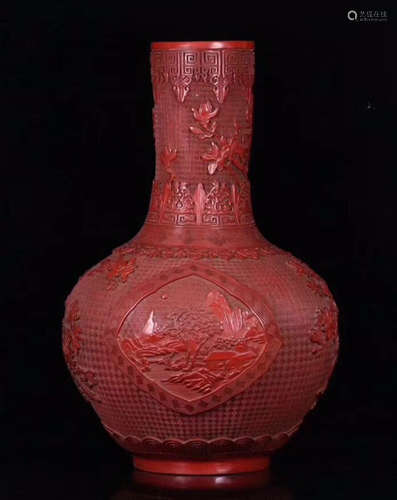 A RED LACQUER CARVED FLORAL PATTERN VASE